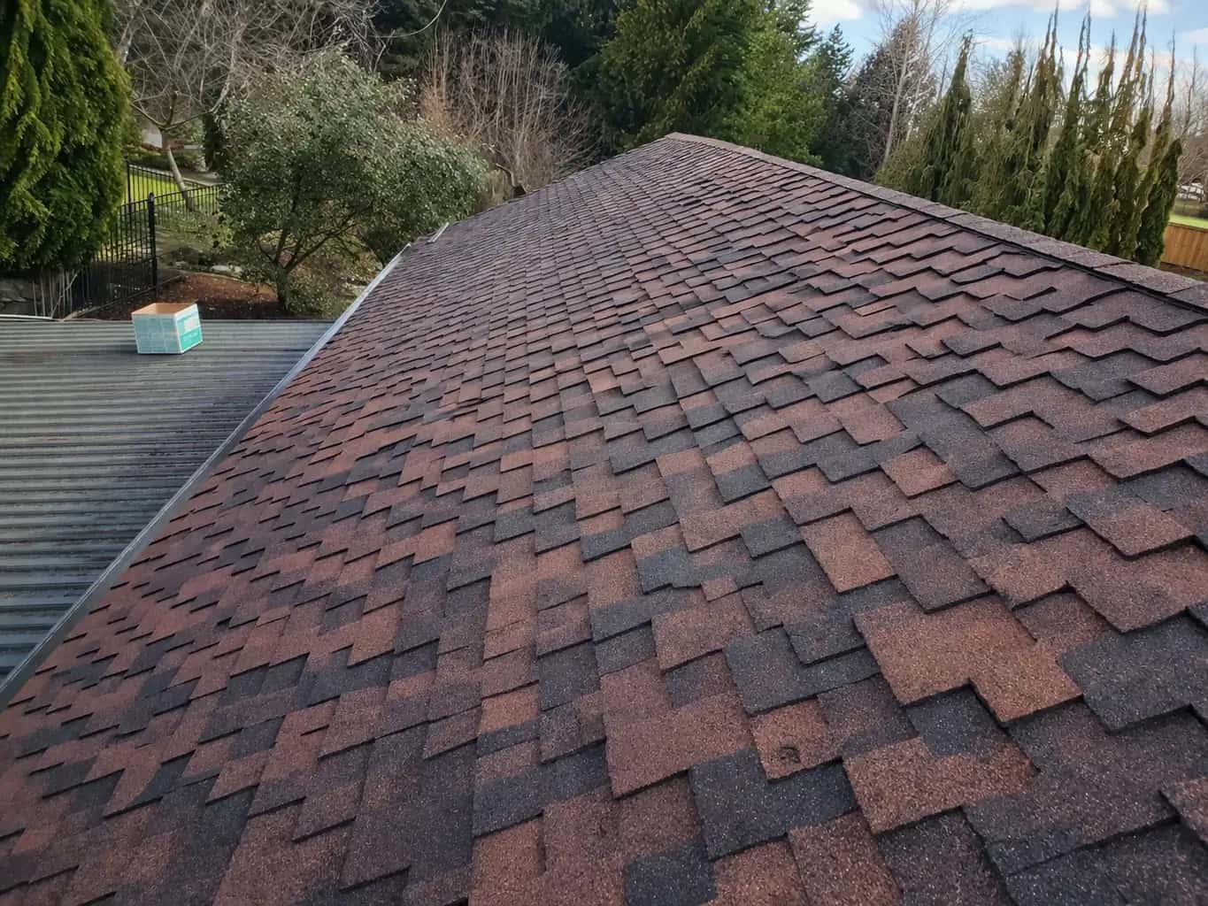 Residential roof replacement with upgraded flashing in Seattle, Washington