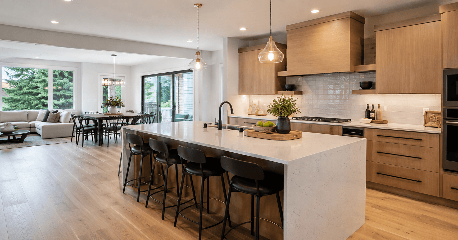 Modern Seattle kitchen remodel with open-concept layout, large island, wall-removal planning, natural light, and improved kitchen flow by Fine Element Construction